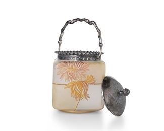 3172
A Mount Washington Royal Flemish Art Glass Biscuit Barrel
Circa 1890s; New Bedford, MA
With Royal Flemish mark to underside, numbered: 523; with impressed "MW" mark to lid, numbered: 4413 / b
The square, clear frosted glass jar fitted with a silver-plated lid, ruffle rim, and handle decorated with gold enamel chrysanthemums on frosted yellow panels
9" H x 5" W x 5" D
Estimate: $300 - $500