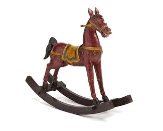 3189
A Continental Carved Wood Rocking Horse
First-Quarter 20th Century
Possibly Italian, with polychrome painted designs
42" H x 50" W x 16" D
Estimate: $800 - $1,200