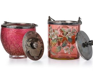 3204
Two Victorian Art Glass Biscuit Barrels
Late 19th/Early 20th Century
Two works:

A Rubina Verde glass jar
Rim with Meriden B. Company mark
The translucent red to green glass with floral coraline decoration and fitted with a silver-plated lid and handle
9.5" H x 5.5" Dia.

A crackle glass jar
Lid impressed: WF / 46
The translucent red crackle glass jar with broken gold foil and fitted with a silver-plated lid and handle
8.5" H x 5.25" Dia.

2 pieces
Estimate: $300 - $500