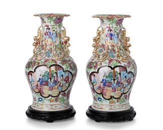 3206
A Pair Of Chinese Rose Mandarin Porcelain Vases
Fourth-Quarter 19th Century
Each famille rose porcelain vase with a Rose Mandarin pattern, gilt highlights, and polychrome enamel decoration with alternating medallions of figures against a ground of scrolling flowers and haute-relief applied lions, each on a carved wood base, 2 pieces
Each: 14" H x 6.25" Dia.
Estimate: $400 - $600
