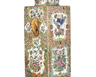 3210
A Chinese Rose Medallion Porcelain Vase
Mid-19th Century
The square body famille rose porcelain vase with a Rose Medallion pattern, gilt highlights, and polychrome enamel decoration with alternating medallions of animals and birds against a ground of peonies, fruits, and insects with opposed elephant mask handles
19.5" H x 9" W x 7" D
Estimate: $1,500 - $2,500