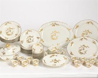 3214
A Bernardaud "Reine Elizabeth" Limoges Porcelain Dinner Service
Circa 1957
Each with green backstamp for L. Bernardaud and Limoges
Executed for the reception of Queen Elizabeth II on the occasion of her visit to France in April 1957, each white glazed porcelain with gilt birds and floral sprays, comprising 1 large tureen (8"), 1 small tureen (6"), 1 vegetable bowl (10"), 1 chop plate (12.25"), 1 large oval platter (15"), 1 small oval platter (12.75"), 1 round platter (12.25"), 1 gravy boat with undertray (8.25"), 2 relish dishes (9.25"), 19 dinner plates (9.75"), 8 salad plates (8.75"), 8 soup bowls (9.25"), 11 demitasse cups (3"), and 11 saucers (4.5"), 67 pieces
Estimate: $1,800 - $2,200