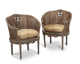 3230
A Pair Of French Carved Wood And Cane Armchairs
First-Quarter 20th Century
Each with carved guilloche crest centering a torch with ribbons and flowers in a dark gold finish and cane back panels over a cane seat with upholstered cushion and raised on fluted legs, 2 pieces
Each: 33" H x 28" W x 19" D
Estimate: $800 - $1,200