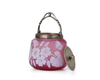 3244
An English Victorian Cameo Glass Biscuit Barrel
Fourth-Quarter 19th Century
Lid with impressed mark: JB & S [possibly Jonathan Bell & Son] / 11166
Likely by Thomas Webb, the acid etched jar cut from opaque white to frosted pink with geranium motif and butterfly, fitted with a silver-plated lid and handle
7.75" H x 5.5" Dia.
Estimate: $300 - $500