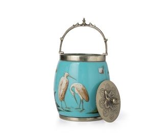 3247
A Victorian Art Glass Biscuit Barrel
Late 19th/Early 20th Century
The opaque blue glass jar with painted cranes and flowers, fitted with a silver-plated lid, handle, and foot
9" H x 4.5" Dia.
Estimate: $300 - $500