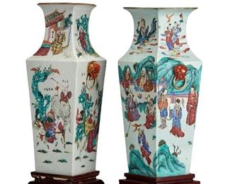 3249
A Near-Pair Of Chinese Porcelain Vases
Late 19th/Early 20th Century
One with partial remnants of a red wax seal to underside
Each tapering, square-form vase decorated with underglaze and overglaze painted figural scenes flanked by opposed lion's mask handles and raised on a carved wood stand, 2 pieces
Each: 18.25" H x 6.5" W x 6" D
Estimate: $1,000 - $1,500