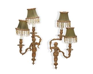 3269
A Pair Of Two Bronze Figural Wall Sconces
Late 19th/Early 20th Century
Faintly signed: Garre
Each with a central figure with two-branch armature supporting candle sconces and cloth shades
Each overall: 24" H x 10.5" W
Estimate: $1,500 - $2,500
