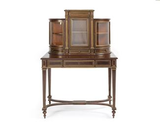 3270
A French Brass-Inlaid Mahogany Vitrine Desk
Second Half 19th Century
With a mahogany and satinwood superstructure with a rectangular beveled and brass-molded pediment above three glazed cabinets each fitted with a single shelf, over three short drawers, atop the desktop fitted with a locking frieze drawer with velvet-lined interior, the compartment further fitted with three short hidden drawers, raised overall on tapering squared legs joined by an X-form stretcher
55.5" H x 35.625" W x 19.125" D
Estimate: $800 - $1,200