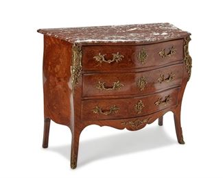 3271
A French Louis XV-Style Commode
Late 19th/Early 20th Century
With a brown marble top over three long drawers with floral marquetry veneer and gilt-bronze mounts raised on slightly out-swept legs with sabots to the feet
34.25" H x 42.75" W x 18.75" D
Estimate: $600 - $800
