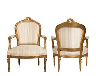 3274
A Pair Of French Louis XVI-Style Armchairs
First-Quarter 20th Century
Each chair with carved giltwood carcass and pink and blue striped silk upholstery, surmounted by a floral wreath crest flanked by two scrolled arms with elbow pads and raised on four fluted legs, 2 pieces
Each: 37.25" H x 27.25" W x 25" D
Estimate: $600 - $800