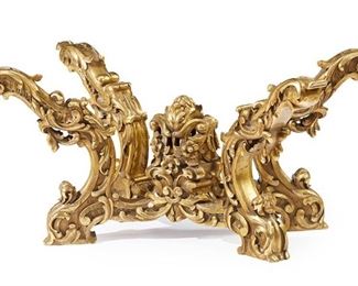 3275
A Continental Carved Giltwood Coffee Table Base
Late 19th/Early 20th Century
The giltwood table base with four upward reaching arms with all-over scrolled acanthus leaf motifs, joined by an X-stretcher
17.25" H x 35" W x 20.25" D
Estimate: $800 - $1,200