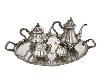 3278
An American Sterling Silver Tea And Coffee Service
20th Century
Each marked: 925 Sterling [lion rampant mark]
Each with a lobed body and scrolled foliate feet, comprising a coffee pot (9.5"), a teapot (7.5"), a covered sugar bowl (5"), a creamer (4.25"), and a serving tray (2.25" H x 26" W x 17.5" D), 5 pieces
139.21 oz. troy approximately
Estimate: $1,500 - $2,000