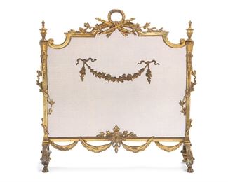 3284
A French Louis XVI-Style Brass Fire Screen
First-Quarter 20th Century
With brass frame centering a laurel wreath and crossed batons with floral swag and woven mesh screen
30.125" H x 30.5" W x 7.75" D
Estimate: $400 - $600