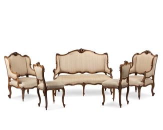 3286
A Continental Carved Wood Parlor Set
First-Quarter 20th Century
Each with carved wood frames centering putti masks and with scroll and leaf design, raised on cabriole legs and beige upholstery, comprising a settee, two armchairs, and two side chairs, 5 pieces
Settee: 40.5" H x 53.25" W x 29" D
Estimate: $1,500 - $2,500