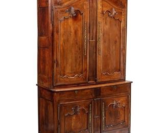 3300
A French Provincial Buffet À Deux Corps
Mid-18th Century
The carved chestnut wood cabinet with molded arch pediment over two conforming doors atop a cabinet base with two drawers and two double-doors, matching hardware
97" H x 53.25" W x 22.75" D
Estimate: $1,500 - $2,500