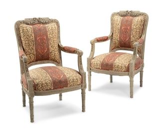 3303
A Pair Of French Louis XVI-Style Armchairs
20th Century
Each with a grey finished carved wood carcass centering a ribbon and floral swag crest over padded arms flanking an upholstered back and seat, raised on fluted tapering legs, 2 pieces
Each: 40.5" H x 26" W x 24" D
Estimate: $1,200 - $1,800
