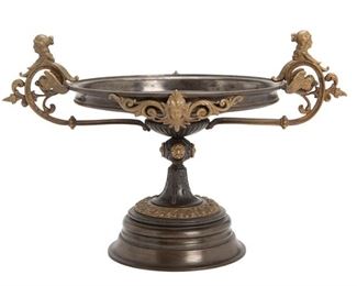 3306
A Neoclassical-Style Bronze Tazza
Fourth-Quarter 19th Century
The patinated bronze tazza with wide shallow dish centering a portrait roundel of a Classical soldier, adorned with brass mounts and figural mask handles raised on a circular foot
11" H x 17" W x 11.625" D
Estimate: $400 - $600