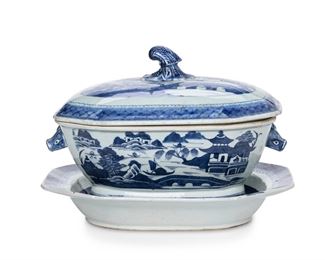 3318
A Chinese Export Porcelain Canton Tureen And Underplate
Mid-19th Century
The glazed white porcelain tureen with blue underglaze decoration depicting architectural landscapes and flanked by opposed boar handles, together with a conformingly designed lid and underplate, 2 pieces
Tureen: 8" H x 13" W x 8.5" D; underplate: 2.25" H x 13.25" W x 10.25" D
Estimate: $800 - $1,200
