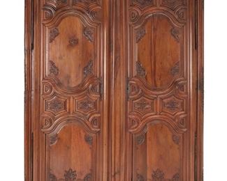 3330
A French Lyonnaise Louis XIII-Style Armoire
18th Century
The large provincial cabinet with foliate carved doors concealing three shelves
91" H x 69" W x 24.5" D
Estimate: $1,000 - $2,000