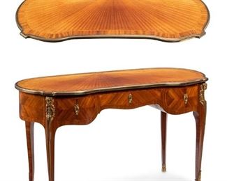 3331
A French Maison Krieger Transitional Bureau Plat
Fourth-Quarter 19th Century
With Maison Krieger metal tag
The Louis XV-XVI transitional-style desk with a kidney form top above a frieze drawer flanked by two further drawers, on gilt-bronze mounted ram-mask-headed cabriole legs
29.75" H x 51" W x 23.5" D
Estimate: $1,000 - $2,000