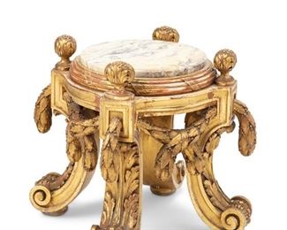3334
A French Louis XV-Style Carved Giltwood Porte-Potiche Stool
Late 19th/Early 20th Century
In the style of Francois Linke, The low stool with an inset round marble top with laurel leaf swags and raised on four scrolled legs
20.5" H x 23" Dia.
Estimate: $2,000 - $3,000