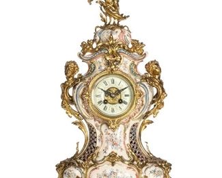 3335
A Continental Rococo-Style Porcelain Mantel Clock
Circa 1900
Movement marked for Aktiengesellschaft für Uhrenfabrikation Lenzkirch
With a porcelain dial with black roman numeral hour markers and two train movement in a glazed bezel set in a glazed porcelain case with a waisted form and decorated with polychrome floral motifs and gilt-bronze figural mounts, surmounted by a putto
23.5" H x 10.5" W x 6.5" D
Estimate: $800 - $1,200