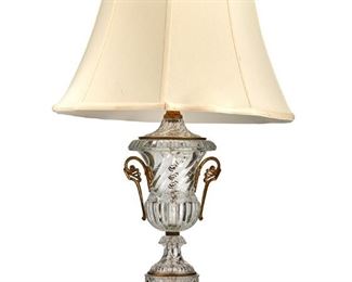 3340
A Baccarat-Style Glass Table Lamp
Mid-20th Century
A single light glass urn form lamp et upon a black marble base with new cream shade, electrified
Overall: 38" H; shade: 18" Dia.
Estimate: $500 - $700