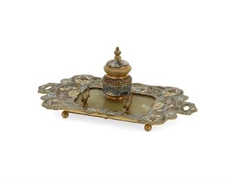 3342
A French Onyx And Champlevé Inkwell
Late 19th/Early 20th Century
The gilt-bronze inkwell with pen holder and champleve enamel lidded well and border surrounding inset green onyx
3.75" H x 8.75" W x 4.875" D
Estimate: $350 - $500