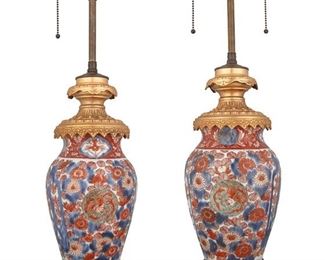 3349
A Pair Of Imari Porcelain Table Lamps
20th Century
Appear unmarked
Each with Imari red, blue, and gilt floral motifs with gilt bronze mountings, each with telescoping electrical fixture, electrified, 2 pieces
Each overall: 25" H x 6" Dia.
Estimate: $1,200 - $1,800
