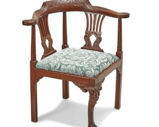 3358
A George III-Style Corner Chair
Late 19th/Early 20th Century
The carved wood corner chair with pierced back splats and scrolled outset arms over green damask-style velvet upholstery
32.125" H x 31.25" W x 28.75" D
Estimate: $400 - $600