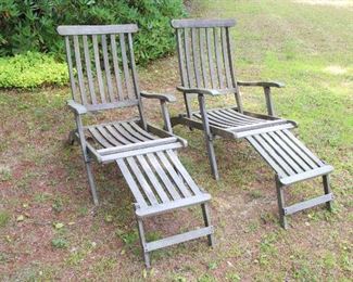 pair of teak lounge chairs