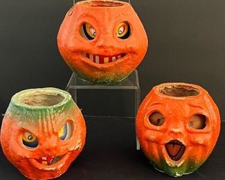 Three Vintage Paper Mache Pumpkins with varying degrees of wear including some paint loss and the largest one has a rip on the side which can be seen in the photo gallery. 