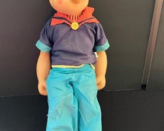 Vintage Popeye Doll by Guns with some wear including missing a snap on his shirt. The voice box does not work.