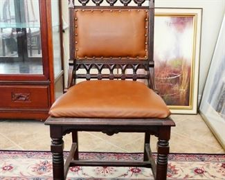 Armless Leather Cushioned Chair With Carved Designs