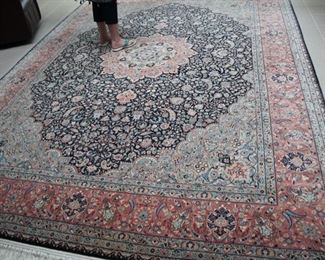Many hand woven Oriental rugs all over the house