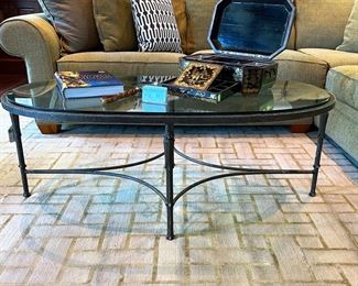 * La Barge style Glass top Wrought Iron Oval Cocktail/Coffee Table with aged green patina (26”x18”x50”).
