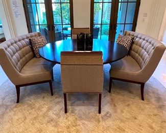 * David Gilbert Vanguard Circular Dining Table with two Banquets and two Captains Chairs (66”Dia).
