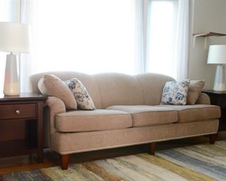 Three cushion couch with matching chair and ottoman.  Sold as a three piece set.  