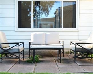 Patio furniture set includes love seat, 2 chairs and table.  