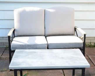 Patio furniture set includes love seat, 2 chairs and table.