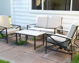 Patio furniture set includes love seat, 2 chairs and table.