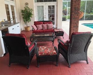 Hampton Bay Woven All Weather settee, 2 chairs, 1 ottoman, and glass coffee table. 

