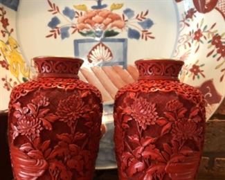 Two exquisite hand carved cinnabar mirror image urns over cloisonné 