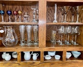 Glassware, Bohemian stemware, beer glasses, white porcelain serving items, martini glasses. 