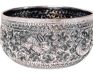 Close up details of silver offering bowl.  Hand chased animals depicting the zodiac days of the week.  About 4” across.  