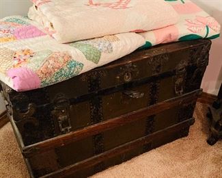 two trunks  and several  handmade  quilts