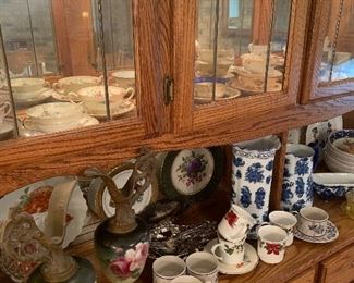 huge  tea cup  collection,  blue and white  vintage  pottery and a nice  lighted  china  cabinet