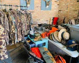THREE rolling rack filled with like new hunting clothes—XL with size 42 pants