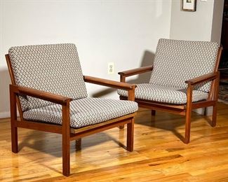 PAIR DANISH MODERN ARMCHAIRS | Teak with exposed joinery, mid-century modern armchairs, with Denmark export label underneath, "Danish Furniture Maker's Control," each with two cushions - h. 29 x w. 27 x d. 29 in.