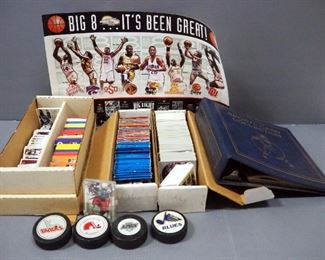 Football, Basketball, And Hockey Sports Cards, Various Brands, Uncounted, Hockey Pucks From Various Teams, Qty 4, Big 8 Poster, And More